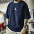 Men’s Retro Indigo Jacquard T-Shirt with textured diamond pattern and front pocket.